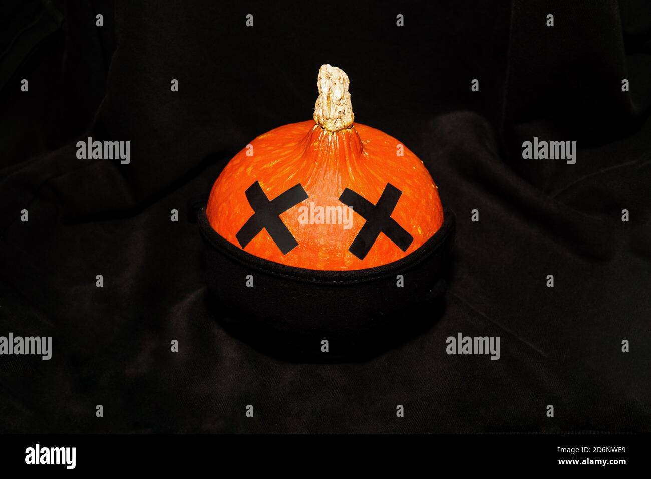 Halloween pumpkin with face mask on Stock Photo