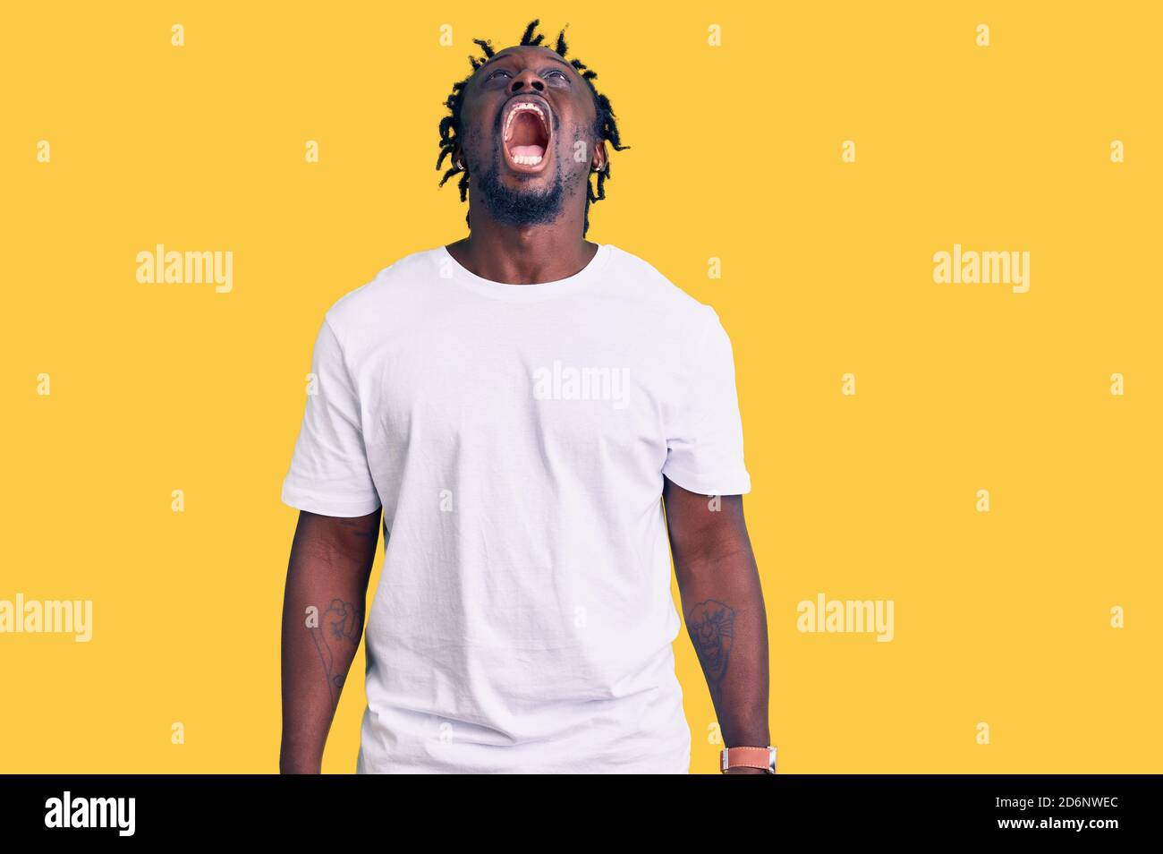 Young african american man with braids wearing casual white tshirt ...