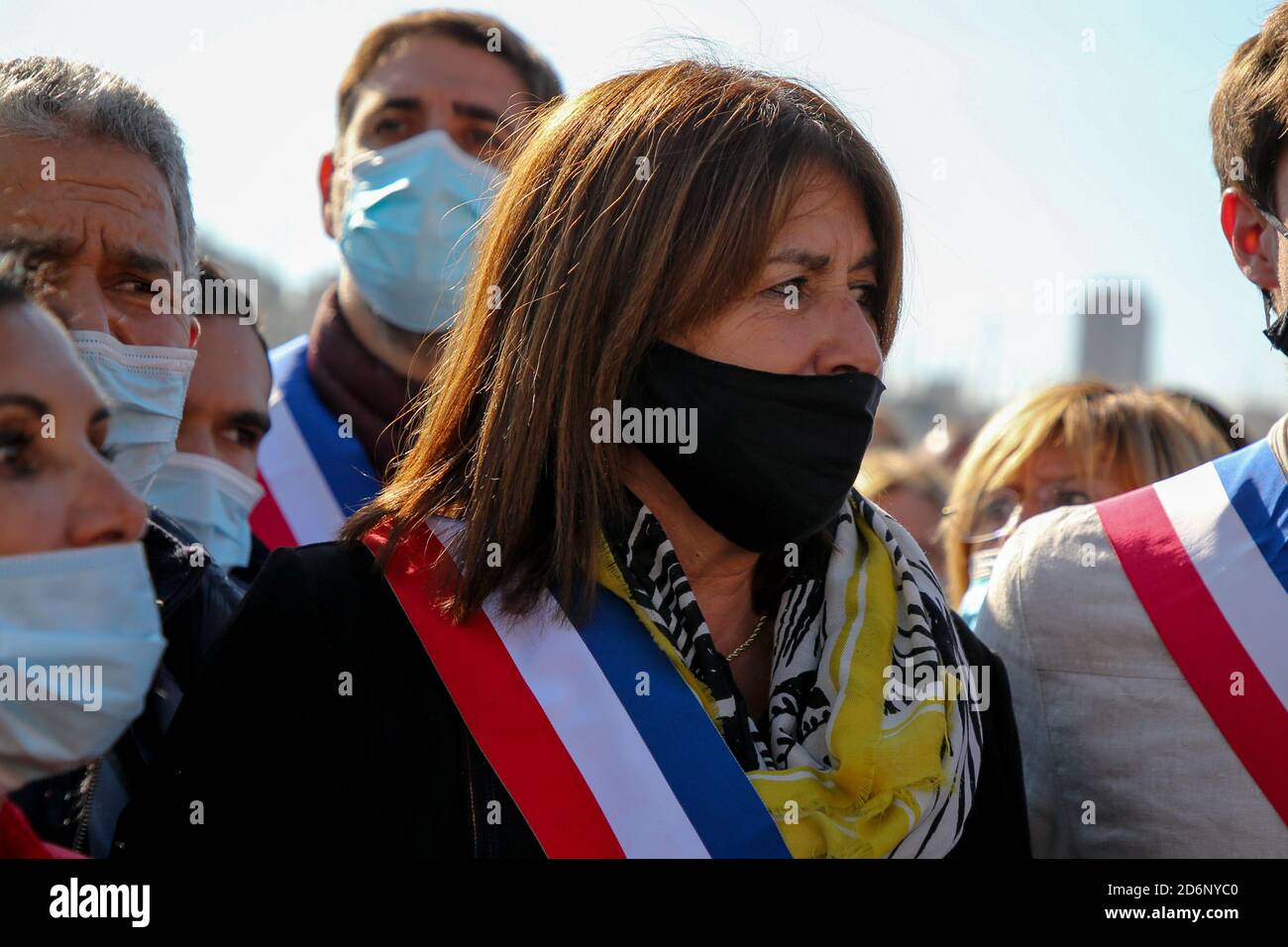 Thousands of protesters wearing face masks gather at Place de la ...