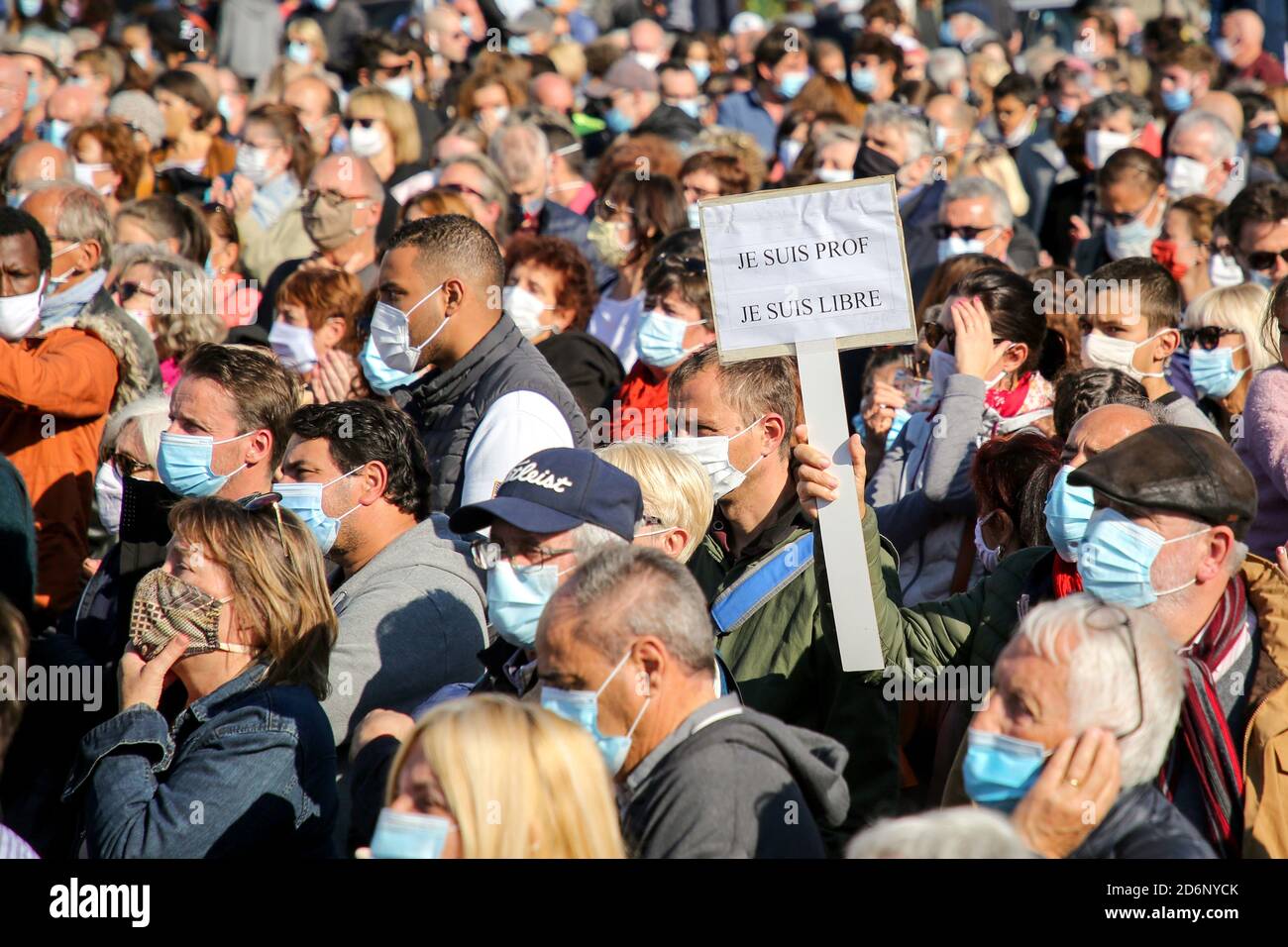 Thousands of protesters wearing face masks gather at Place de la ...