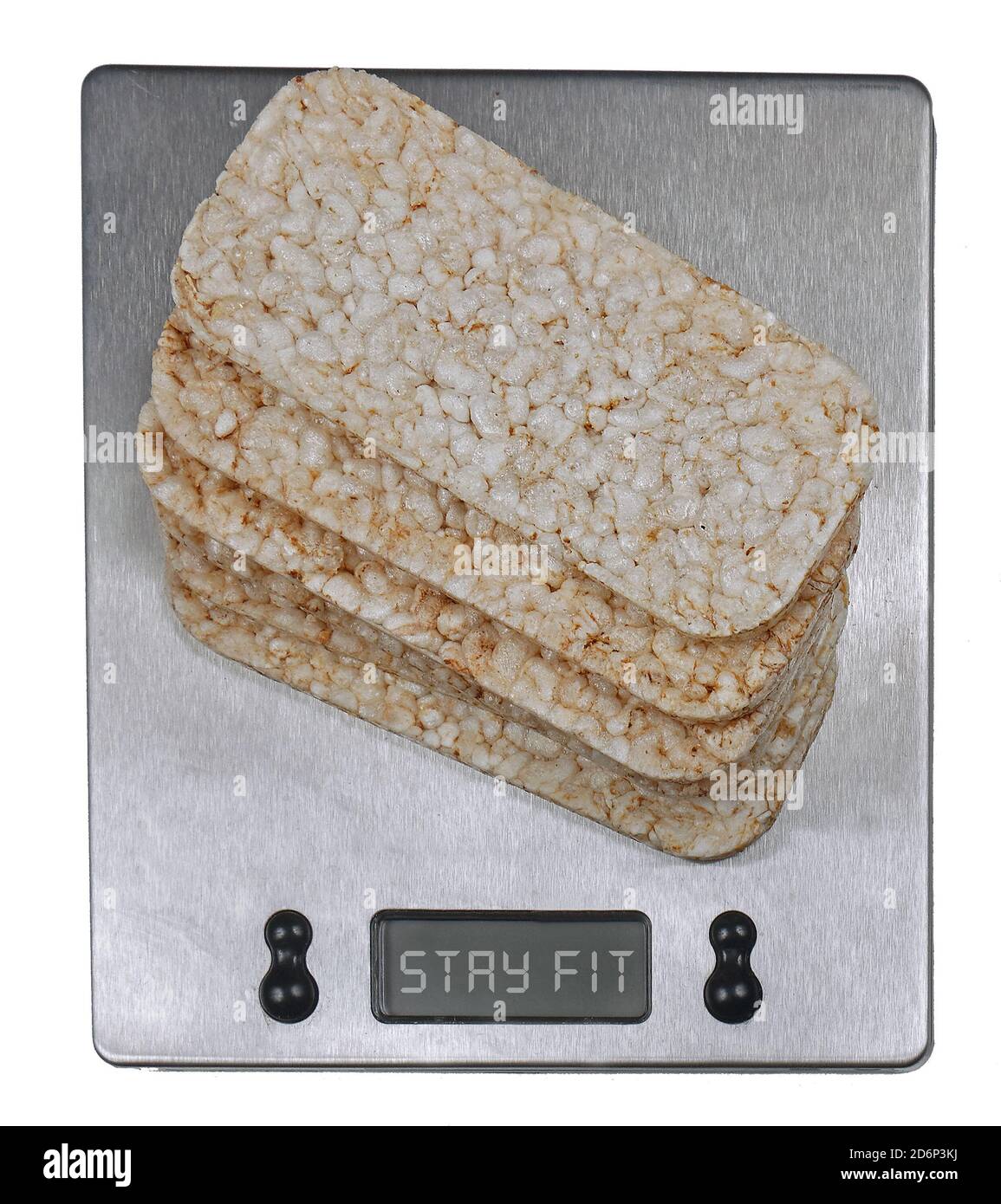 Rice crackers on digital kitchen scale promoting healthy eating lifestyle Stock Photo