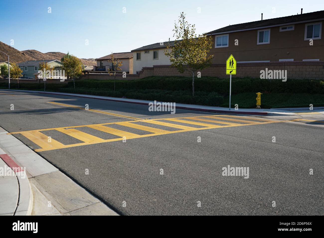 Low angle view of crosswalk and school crosswalk sign Stock Photo