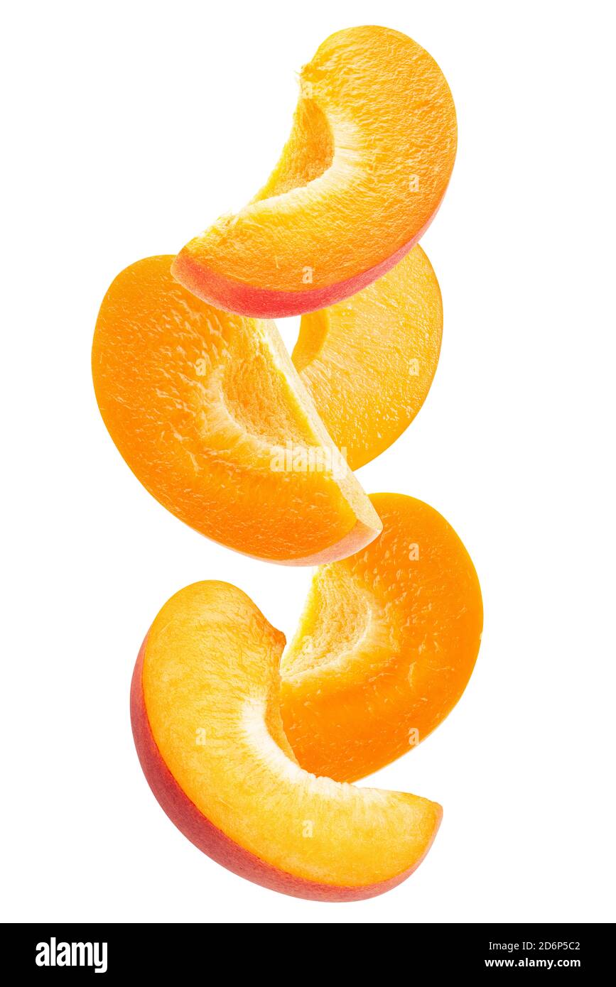 falling apricot slices isolated on a white background. Stock Photo