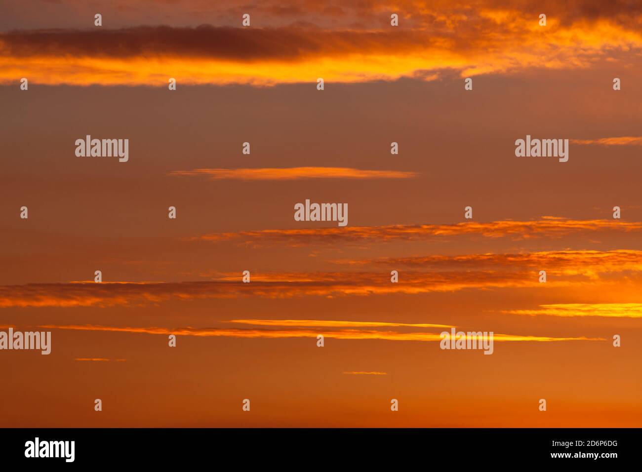 Thick smoke from a nearby forest fire turn the sunset sky into a ...