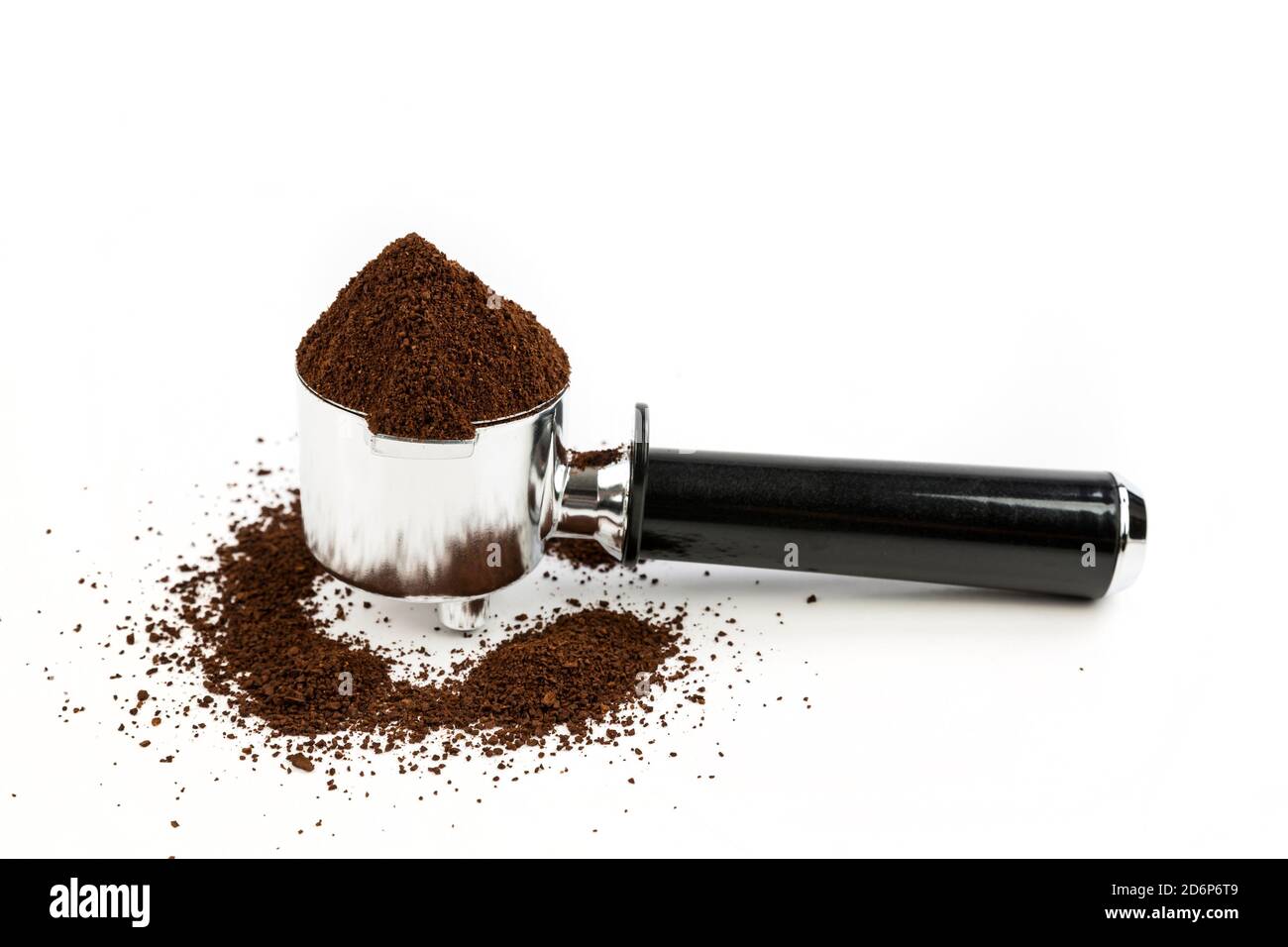 Black and silver coffee filter piled high with ground coffee side view Stock Photo