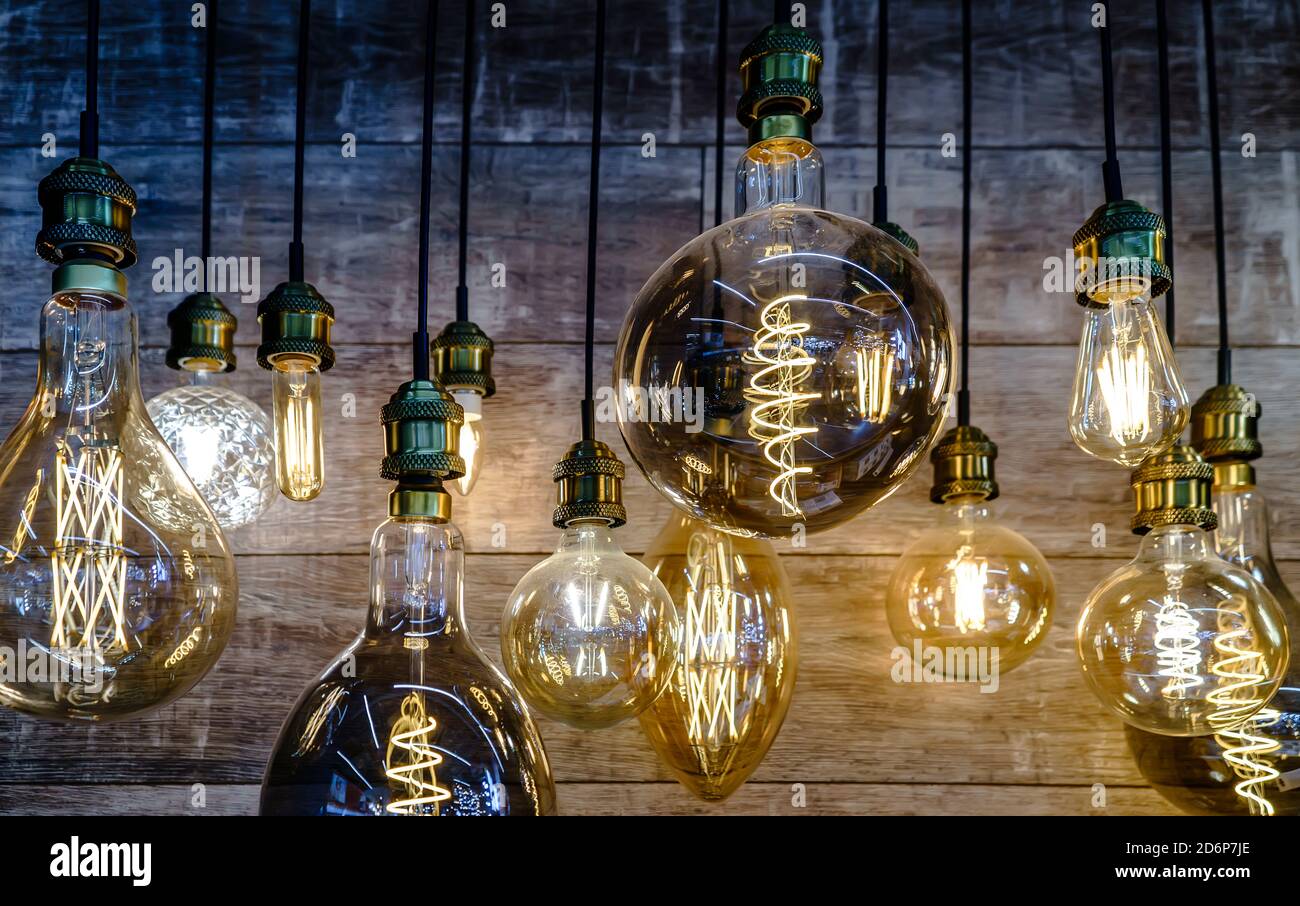 Collection of glowing hanging lamps in the store Stock Photo Alamy
