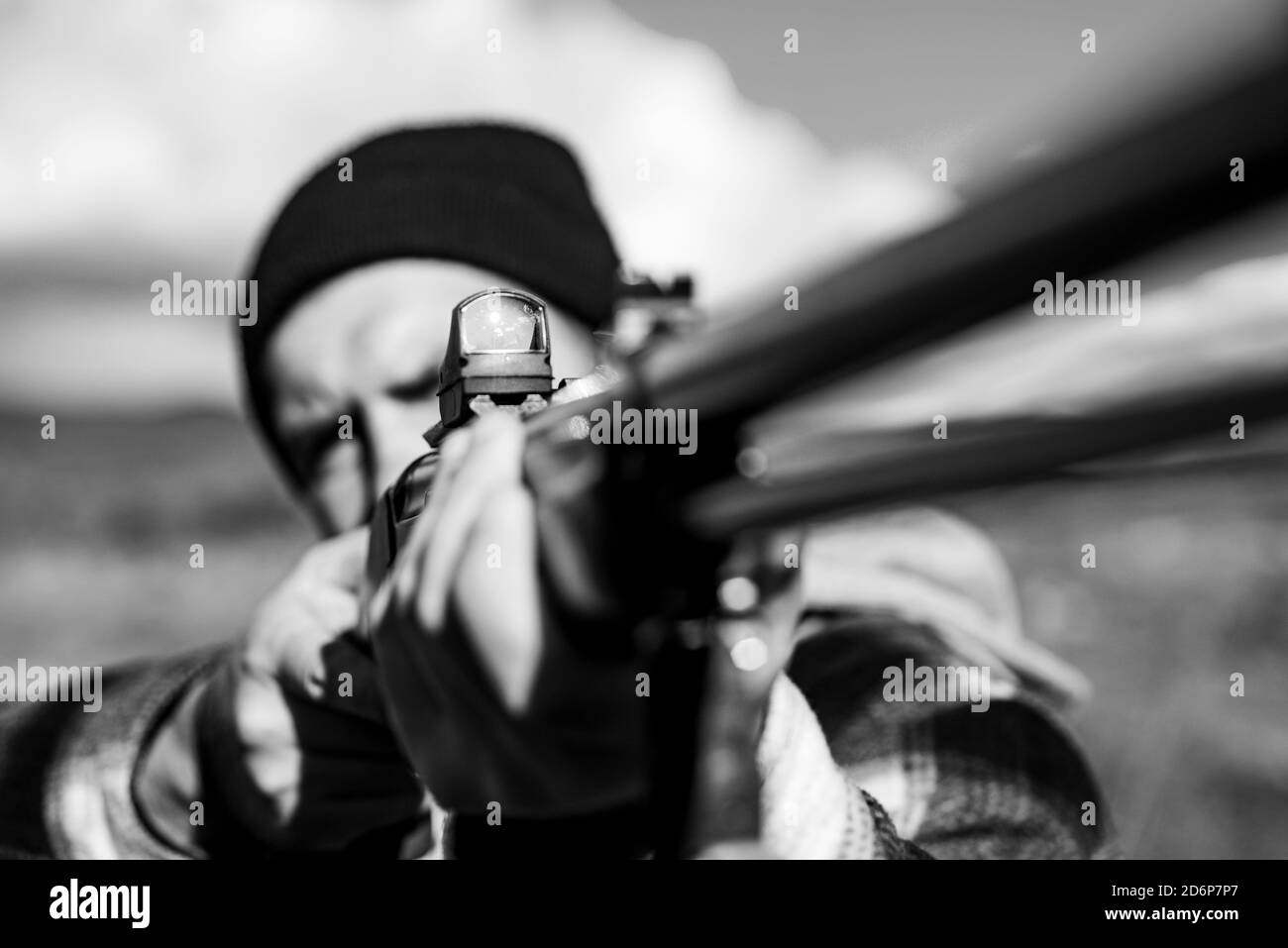 Hunter Target with laser sight. Collimating sight. Hunter with shotgun gun on hunt. Hunter