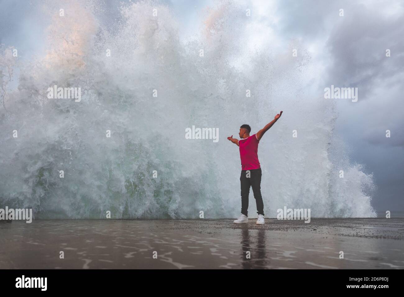 Young caucasian man posing at a sea port. Stock Photo