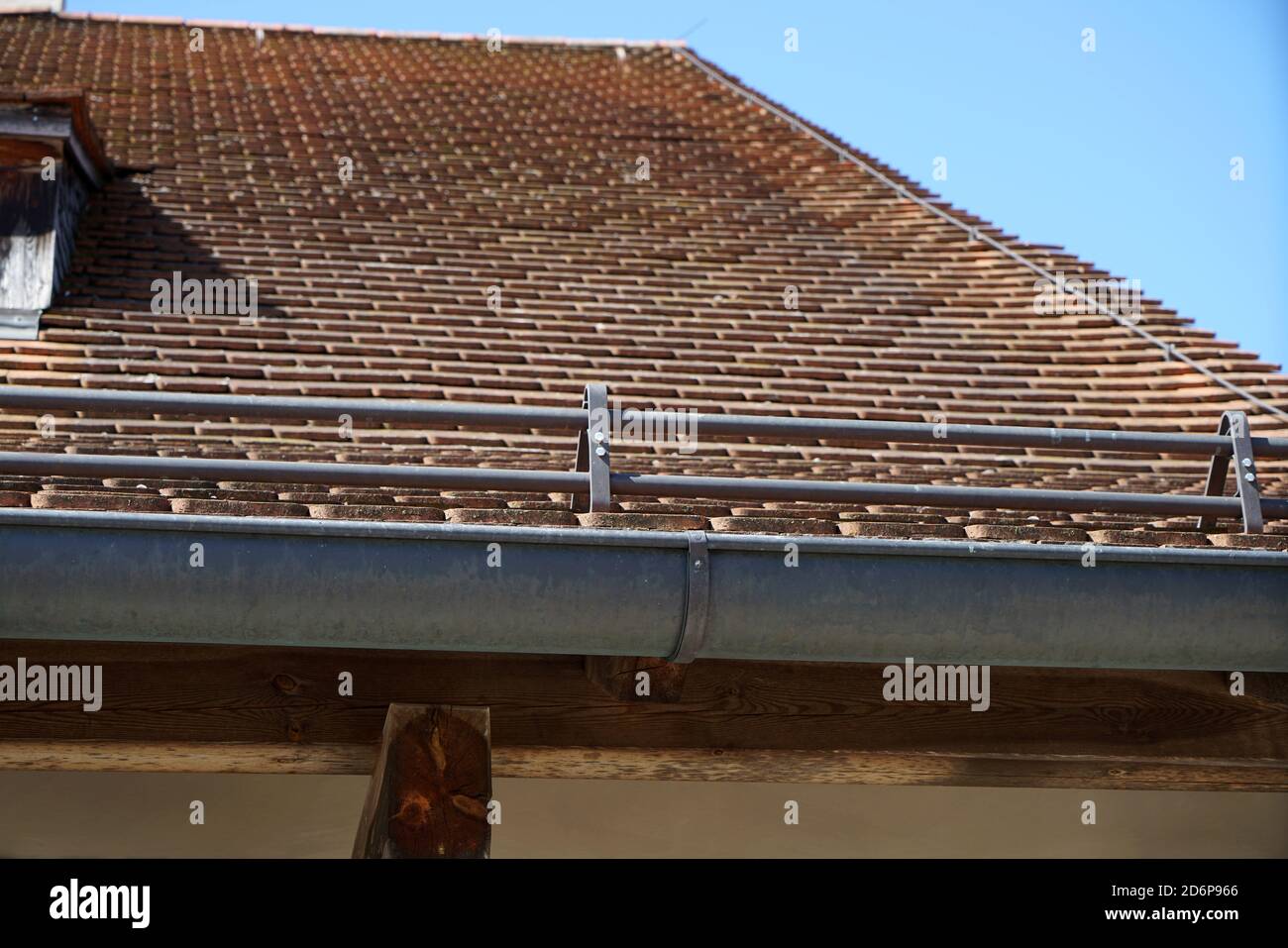 Low angle shot of a building with a concrete tile roof under the sunlight Stock Photo
