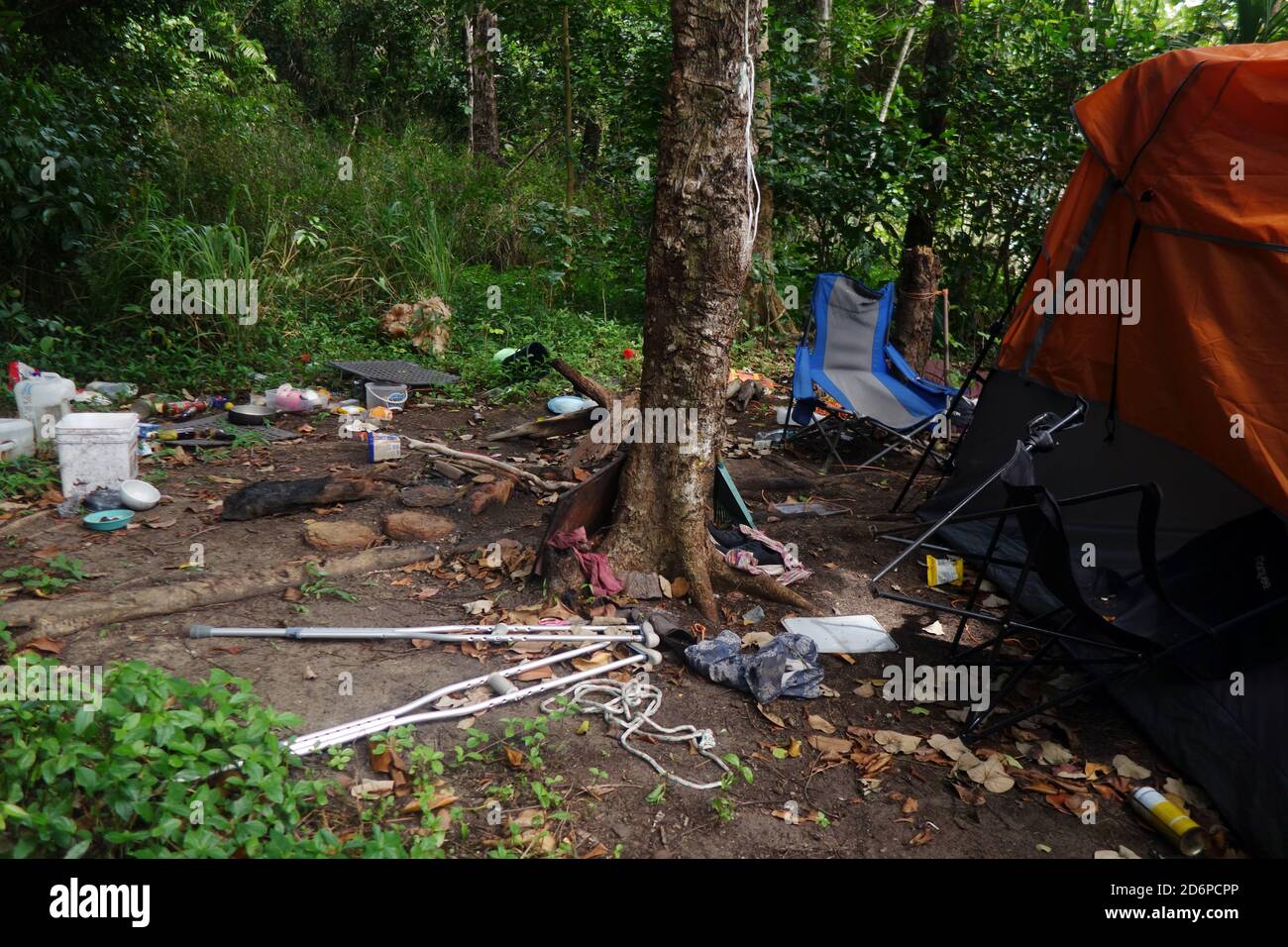 Abandoned illegal bush campsite full of trash, Ella Bay National Park, Queensland, Australia. No PR Stock Photo