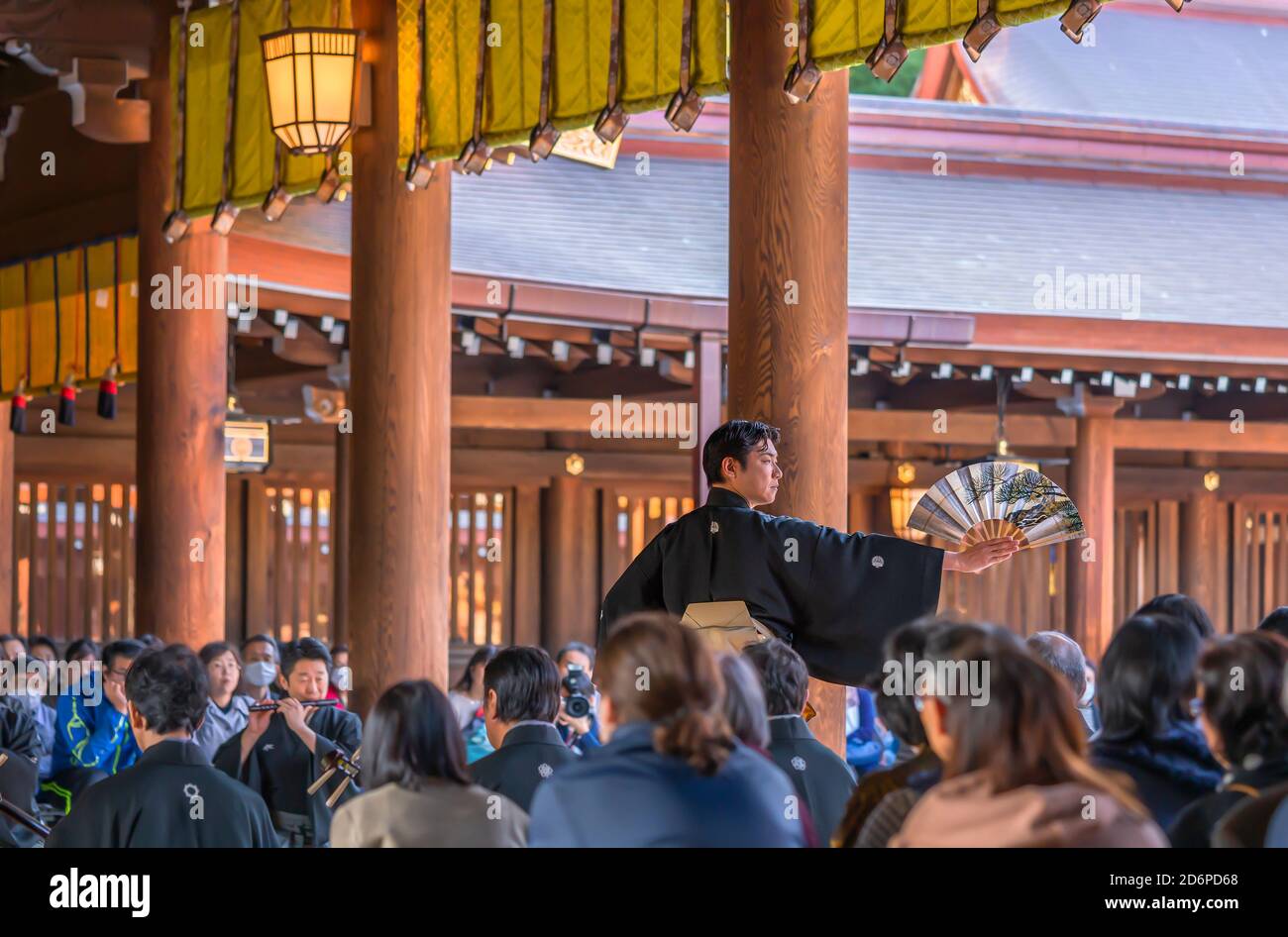 tokyo, japan - november 02 2019: Japanese male in kimono holding a fan during a traditional kagura dance helds in the Shinto Meiji-jingu shrine for th Stock Photo