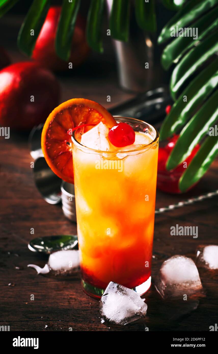 Classic tequila sunrise cocktail with silver tequila, grenadine syrup