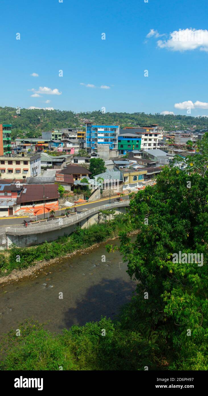 Panoramic view of the city of Tena between green trees and the river with mountains in the background in the Ecuadorian Amazon Stock Photo