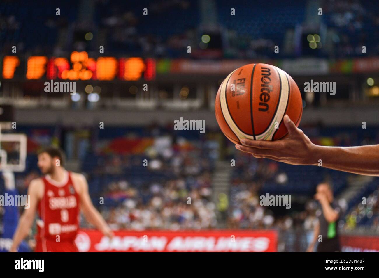 Basketball handed by a referee Stock Photo