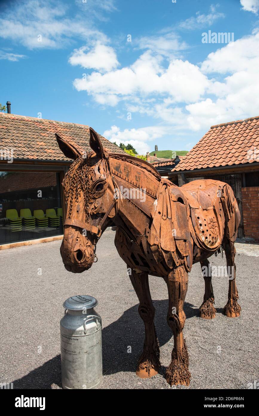 Punch, life-sized horse sculpture made of reclaimed metal by artist Harriet Mead. Somerset Rural Life Museum at the base of Glastonbury, Tor, England. Stock Photo