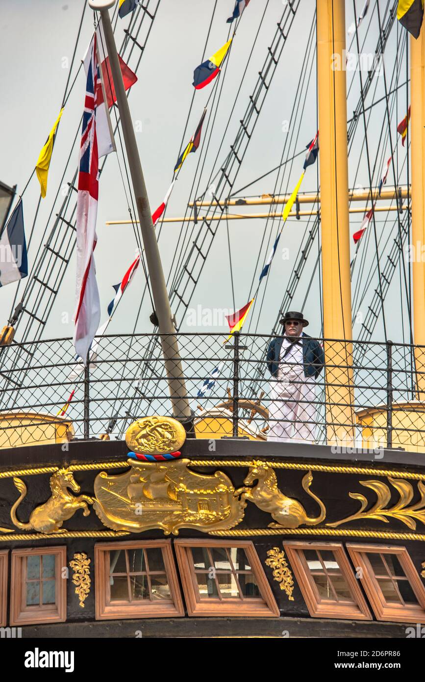 SS Great Britain stern view. Actor in dress standing in front of