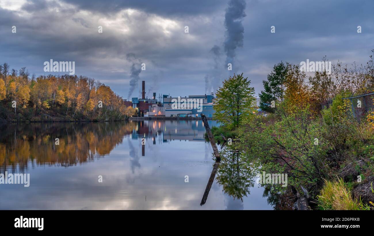 The Resolute Forest Products paper mill reflected in the Kaministiquia