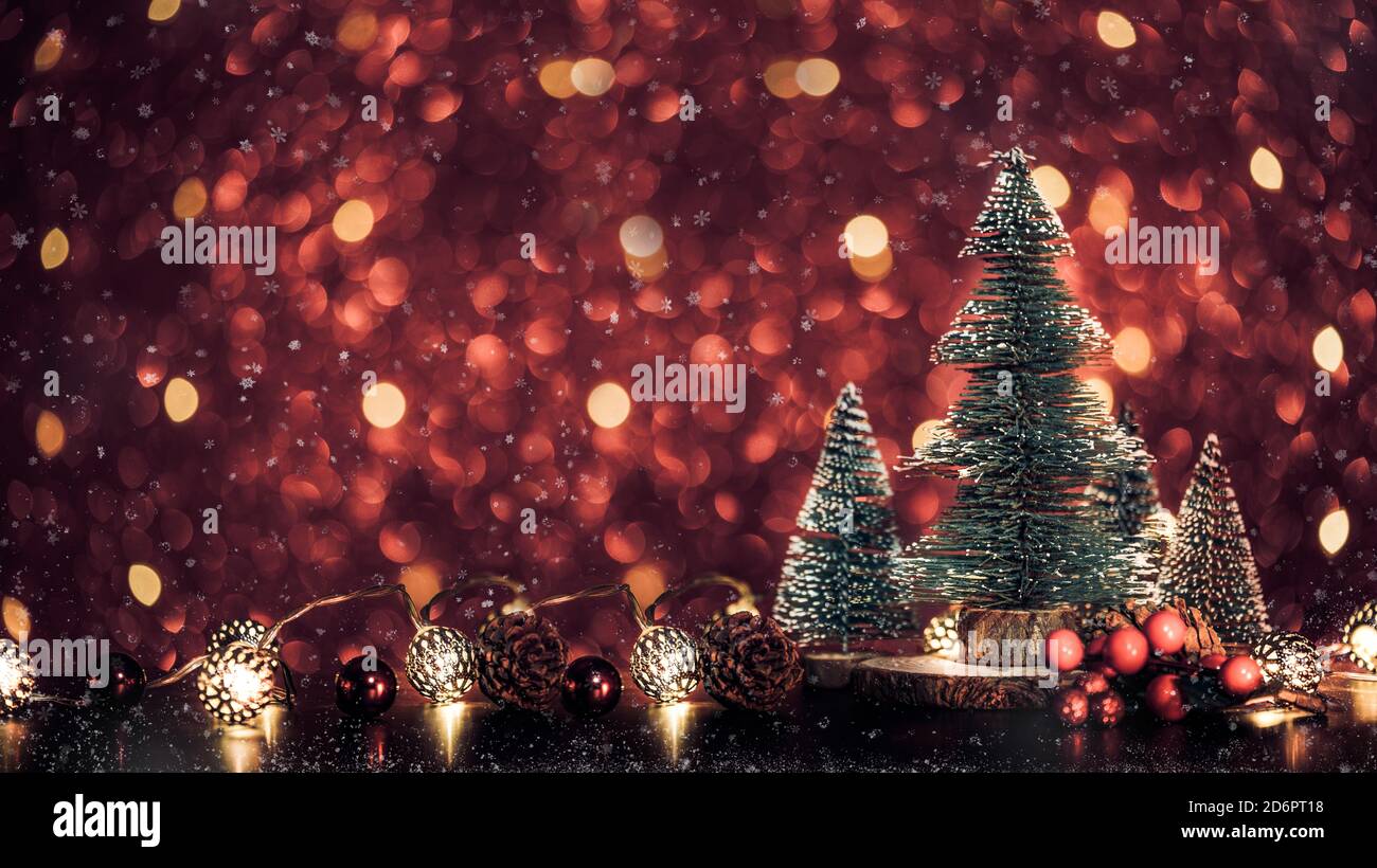 Merry Christmas tree and happy new year background on red glitter sparkling string lights festive bokeh background.holiday celebration greeting card Stock Photo