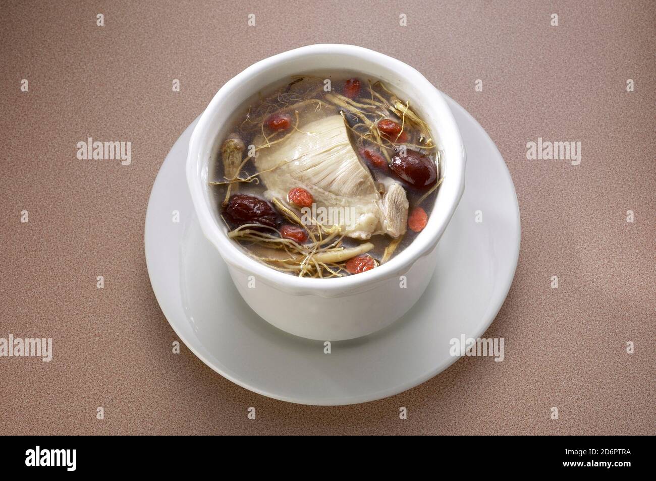 Chinese herbal chicken soup served in a bowl Stock Photo