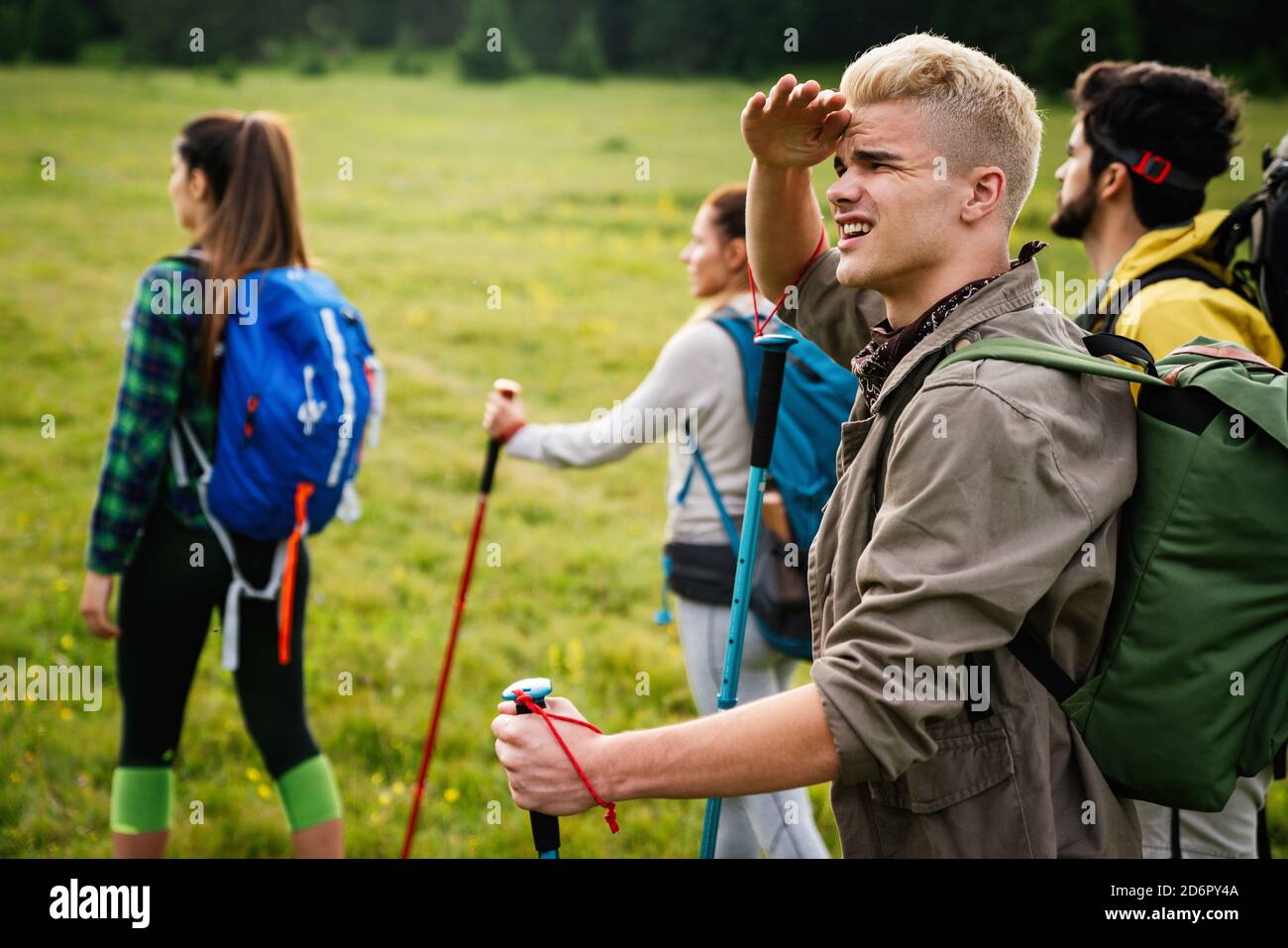 Friends Hiking Together Outdoors Exploring The Wilderness Stock Photo