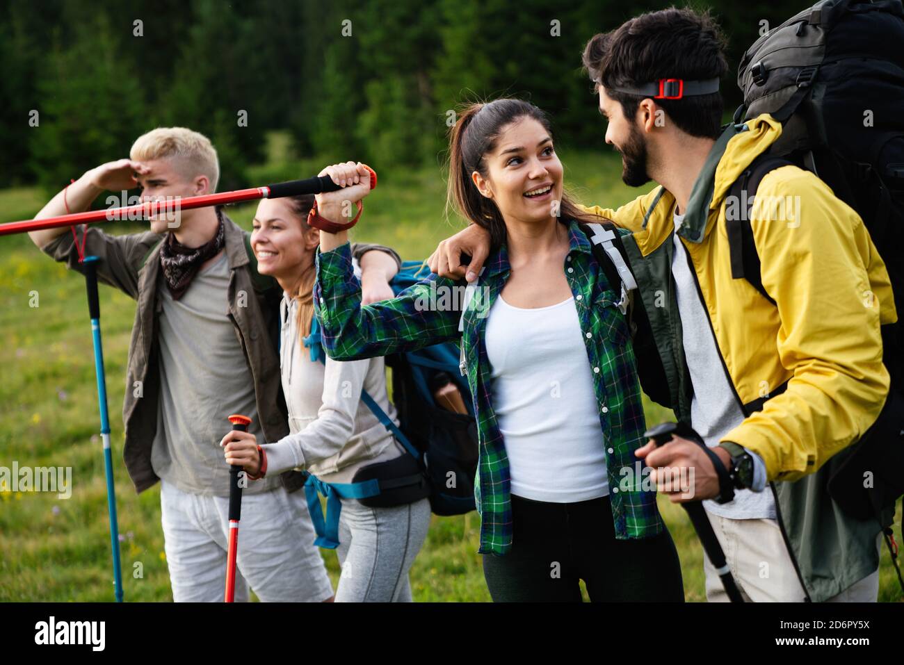 Group of happy friends with backpacks hiking together Stock Photo - Alamy
