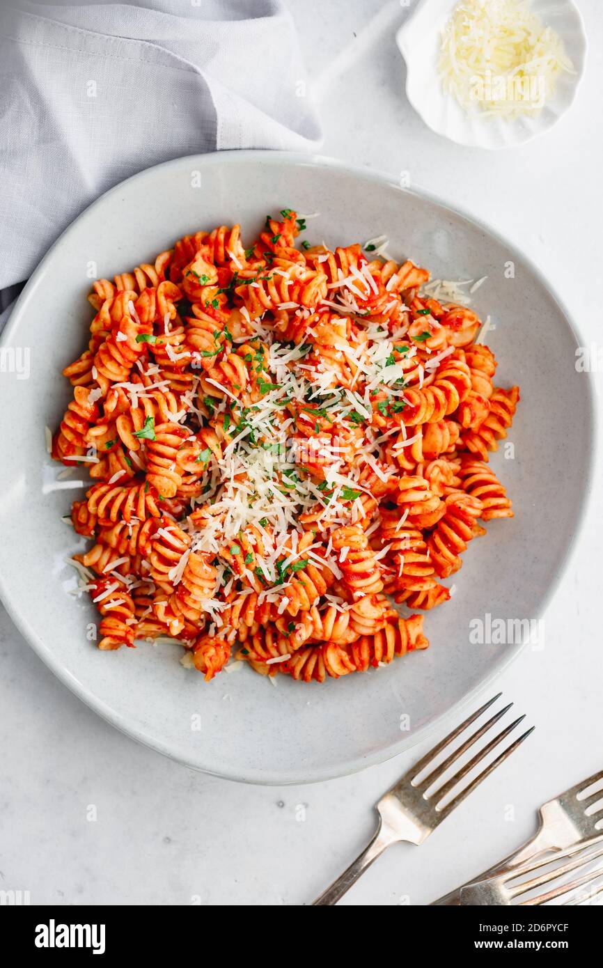 Top view of fusilli pasta with tomato sauce and parmesan cheese Stock Photo  - Alamy