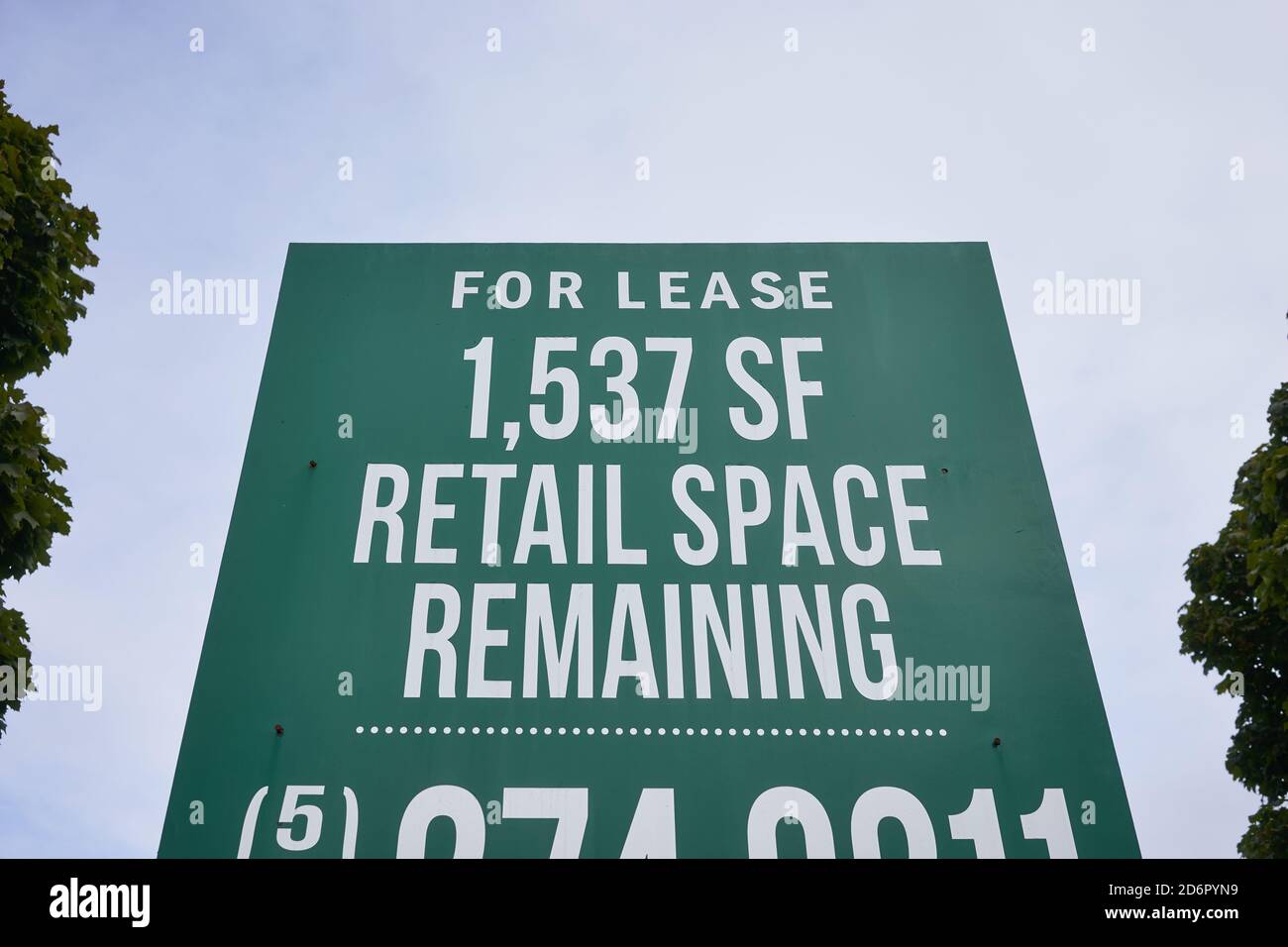 Retail space for lease sign outside a shopping center. Stock Photo