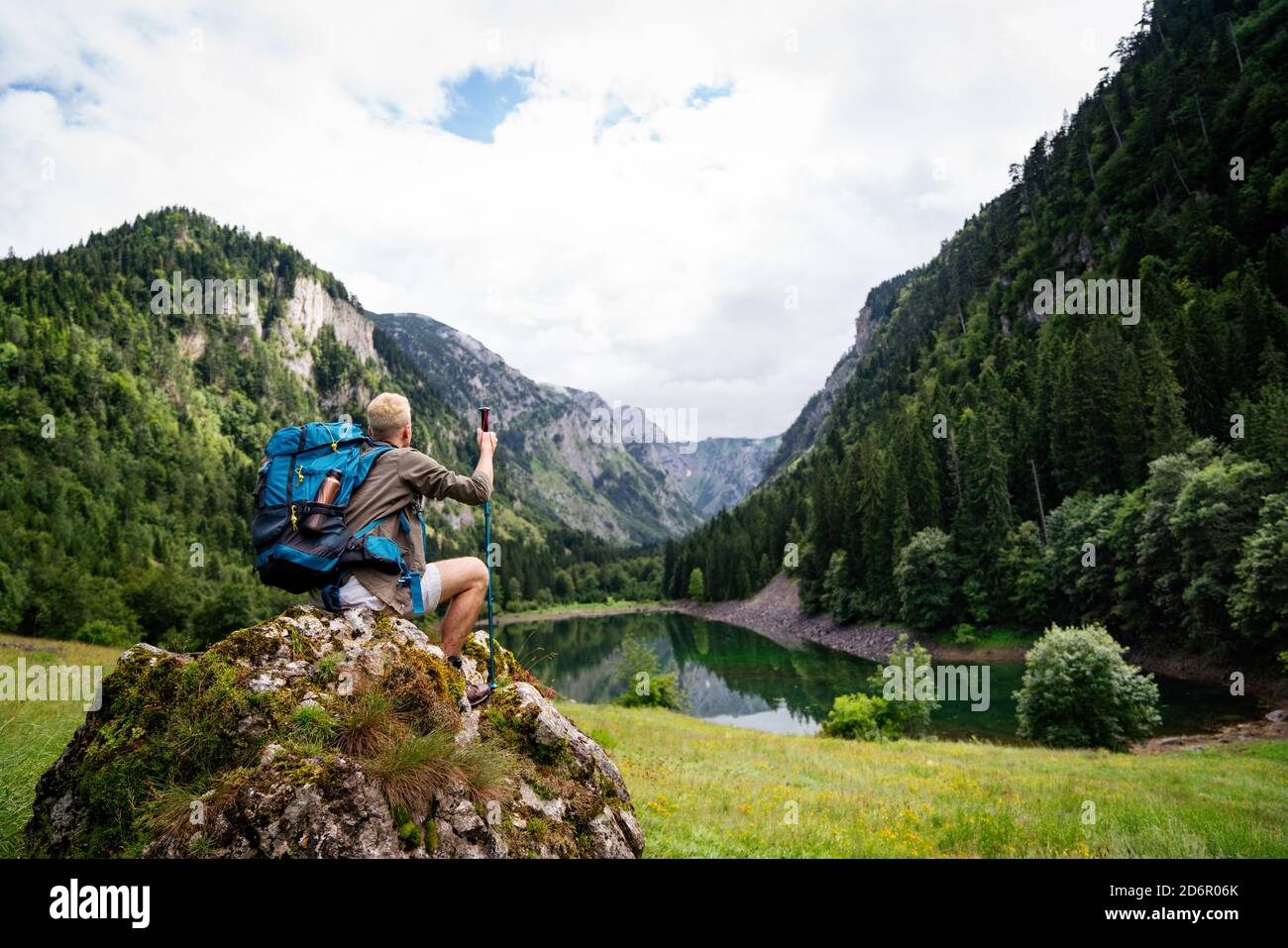 Happy traveler man hiking hi-res stock photography and images - Alamy