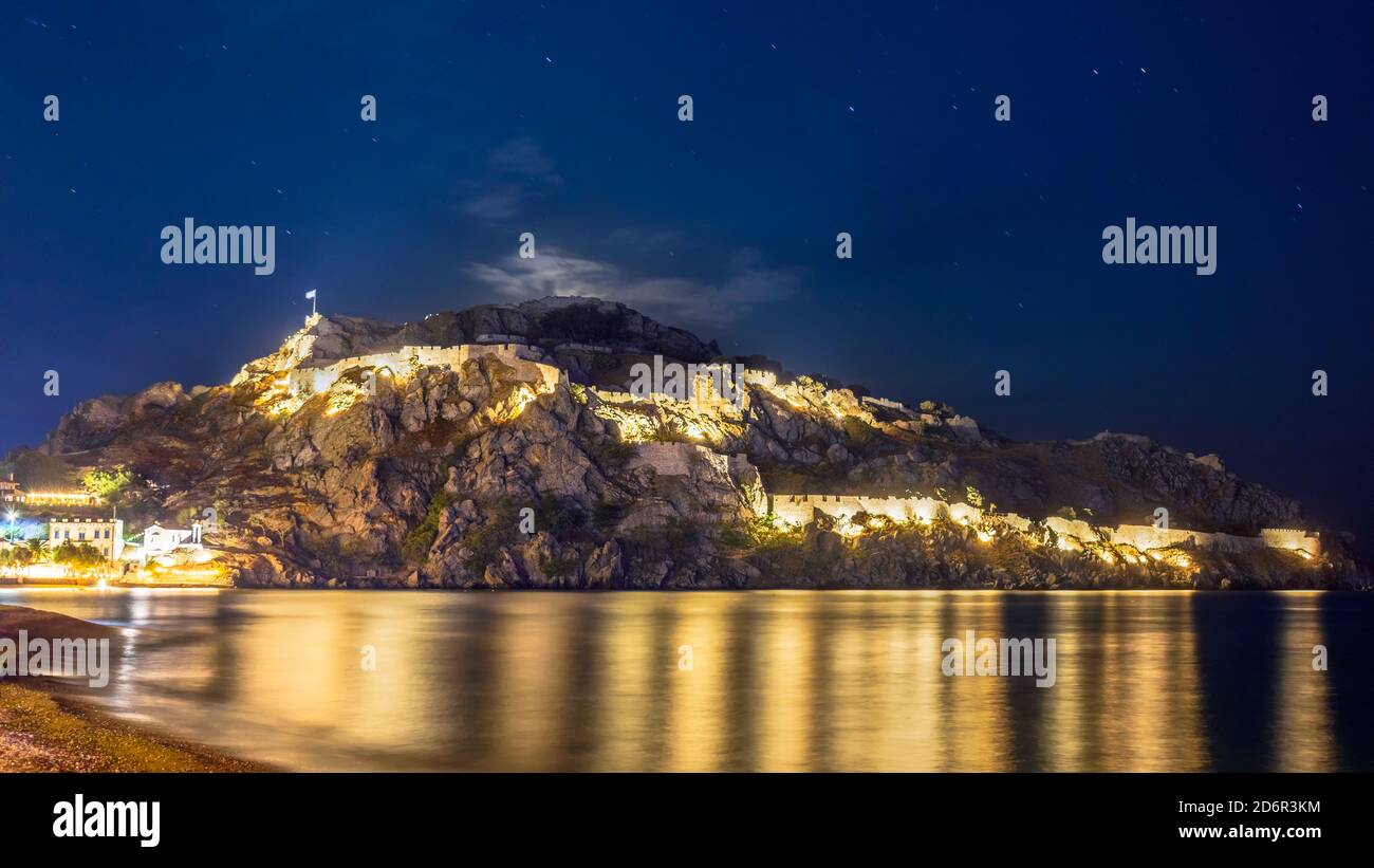 The illuminated castle of Myrina at the foot of Lemnos in Greece Stock Photo