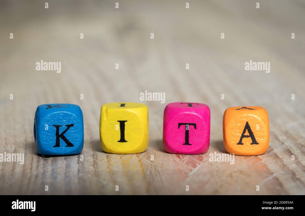Kita (in German Kindergarten) etter cubes concept on wooden background Stock Photo