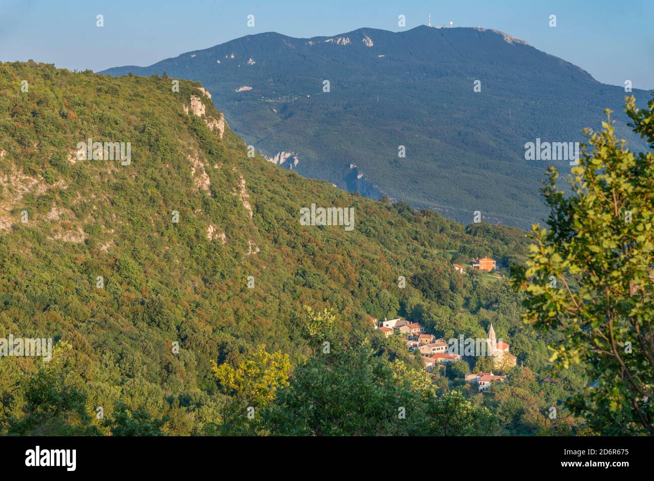 Village of Dolenja Vas and its church and Mount Vojak in the background, Istria, Croatia. Stock Photo