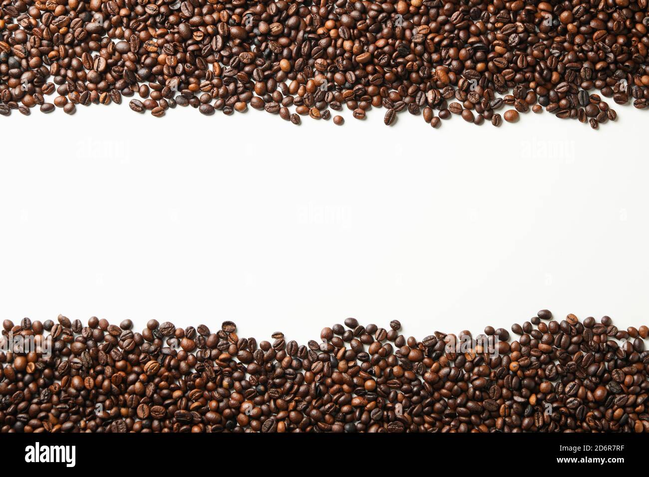 Roasted coffee beans on white background, space for text Stock Photo ...