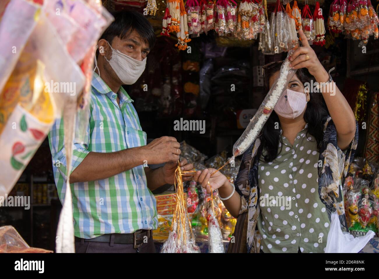 Dehradun, Uttarakhand/India-October 14 2020:A Beautiful Indian lady wearing face mask is shopping for the Navratri festival in Corona pandemic. High quality photo Stock Photo