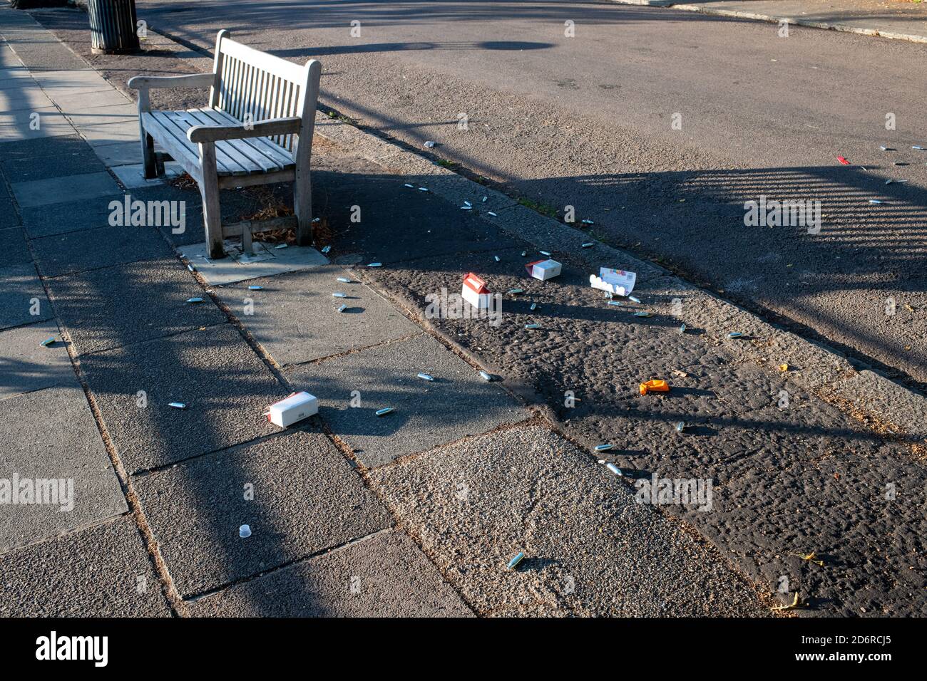 Nitrous oxide "laughing gas" capsules containers silver bottles left littered along the Thames