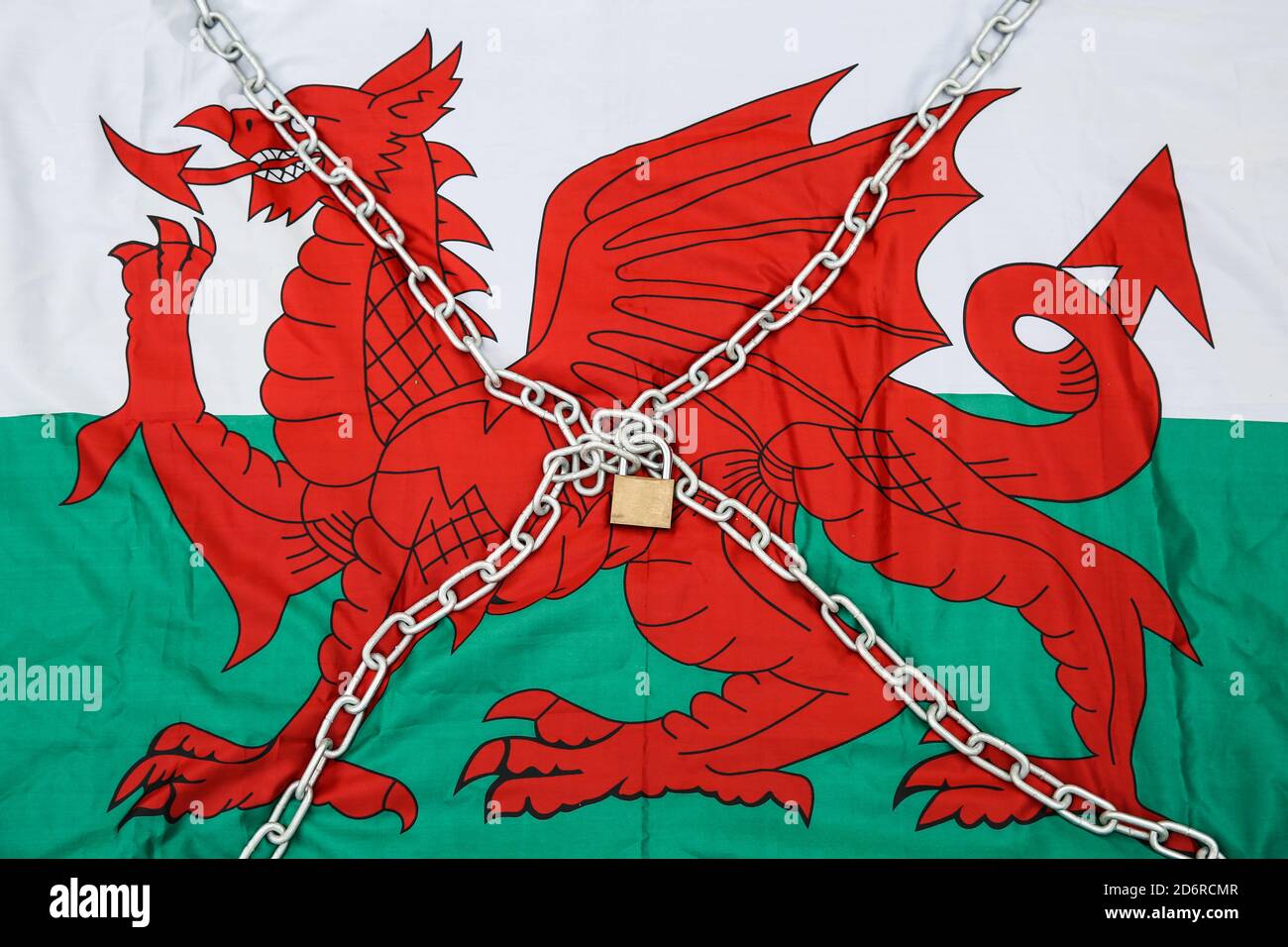 19th October 2020. A Welsh flag in chains. The Welsh Government are discussing the possibility of imposing a second National lockdown on Wales with an announcement due today. ®Jon Freeman/Alamy Live News Stock Photo