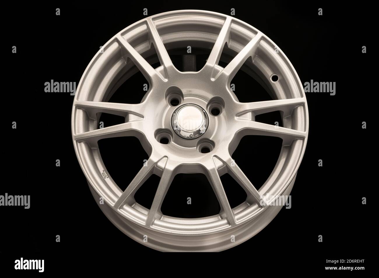 New silver alloy wheel on black background, front view Stock Photo - Alamy