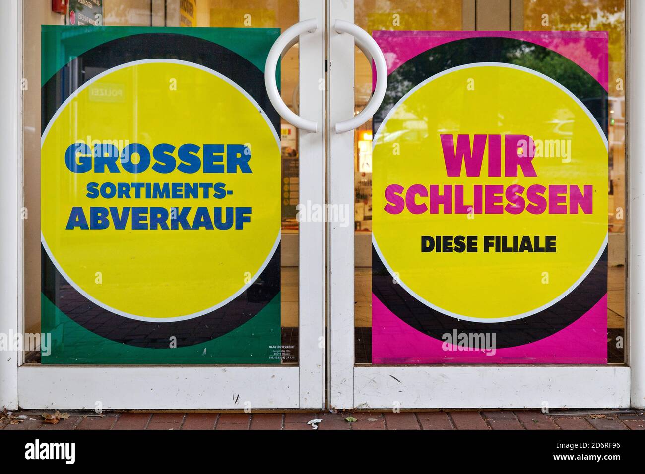 posters lettering 'large assortment sale'  and 'we close this store' in a display window, Germany, North Rhine-Westphalia, Ruhr Area, Witten Stock Photo