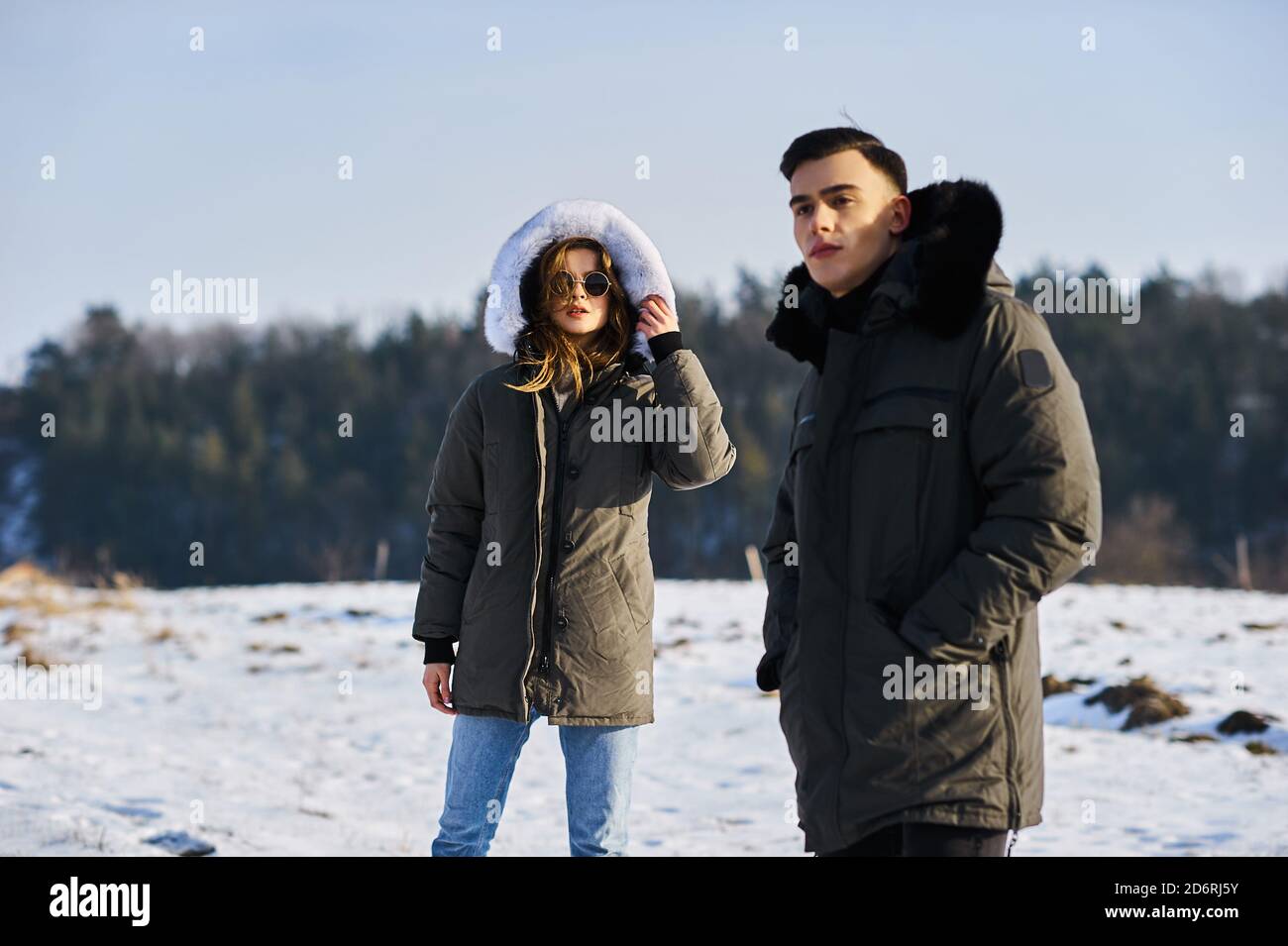 happy couple hugging and laughing outdoors in winter Stock Photo - Alamy