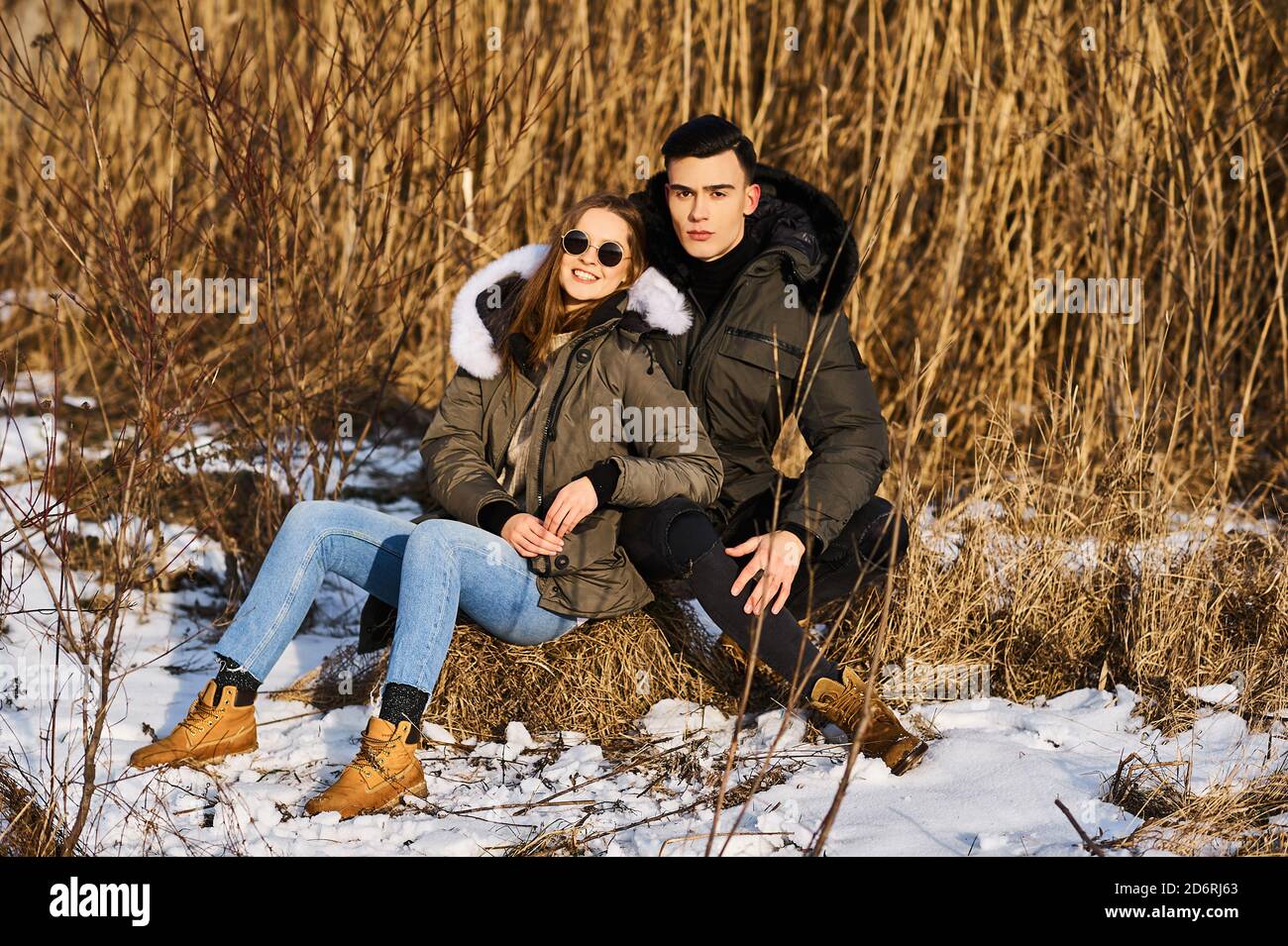 happy couple hugging and laughing outdoors in winter Stock Photo - Alamy