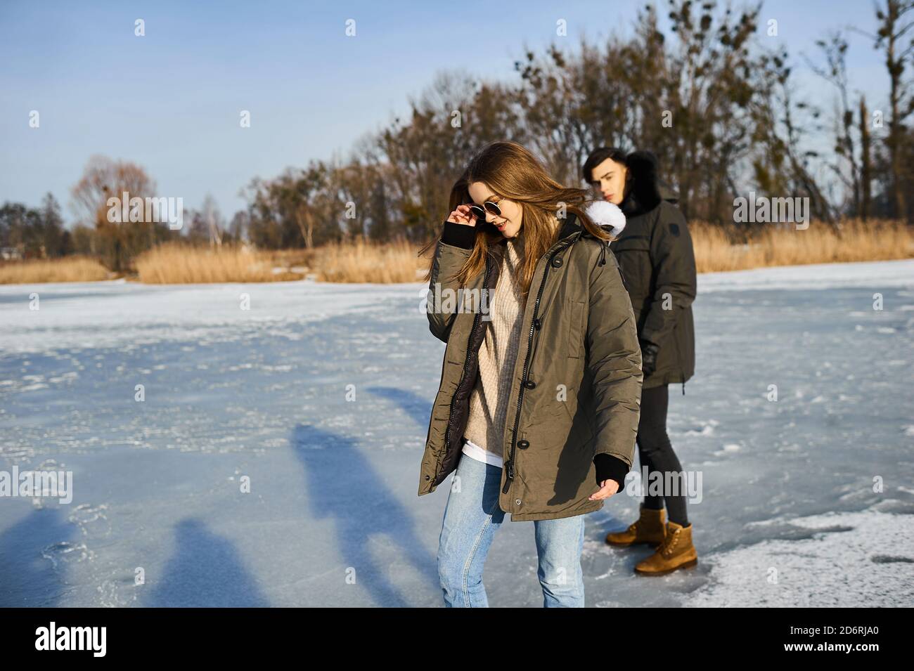happy couple hugging and laughing outdoors in winter Stock Photo - Alamy