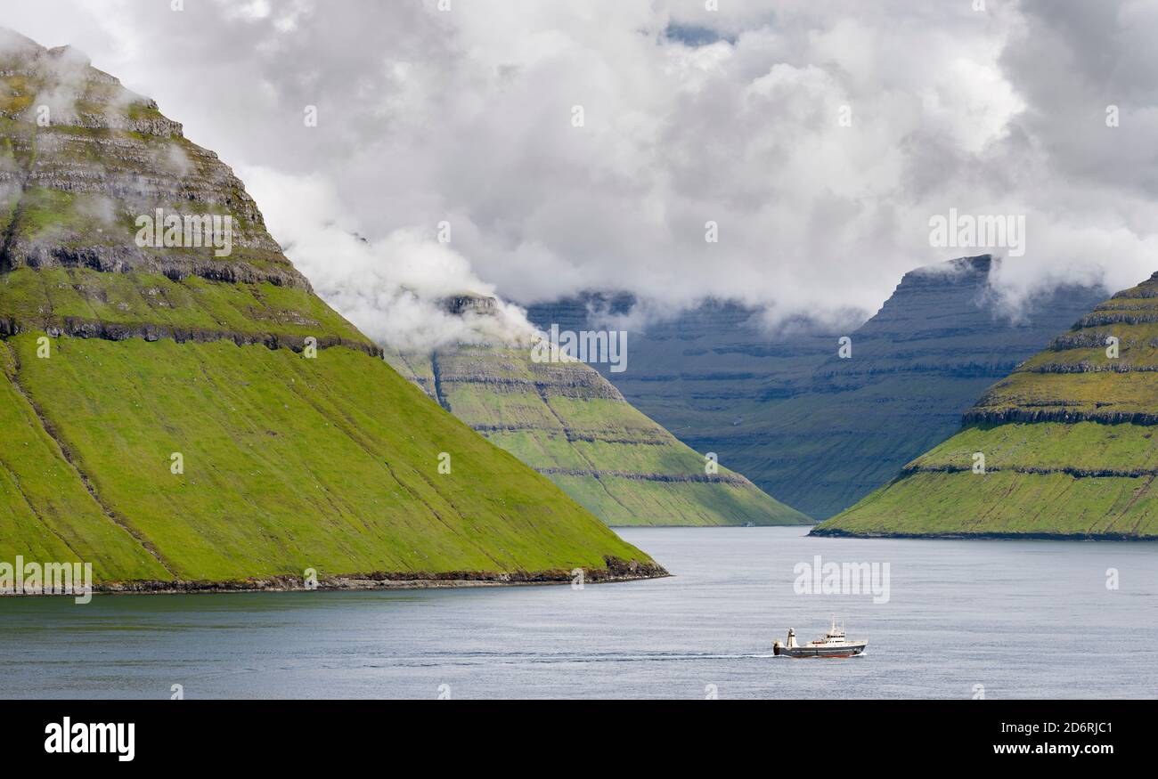 Island Kalsoy, seen from Eysturoy, in the background the island of  Kunoy and Bordoy. Nordoyggjar (Northern Isles) in the Faroe Islands, an archipelag Stock Photo