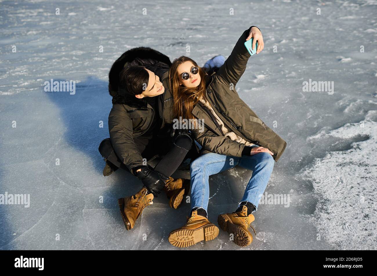happy couple hugging and laughing outdoors in winter Stock Photo - Alamy