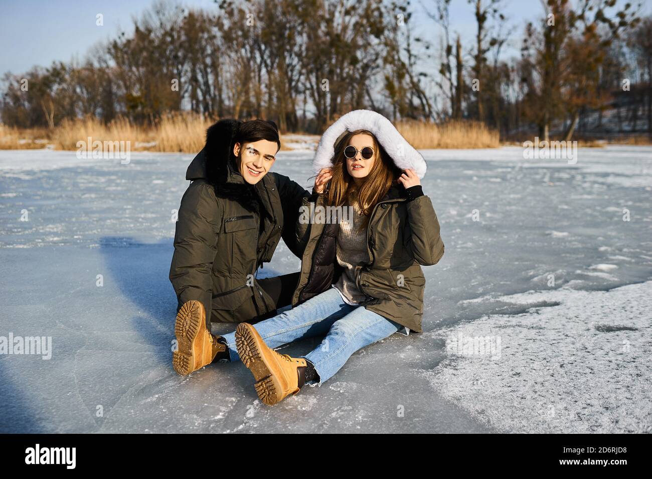 happy couple hugging and laughing outdoors in winter Stock Photo - Alamy