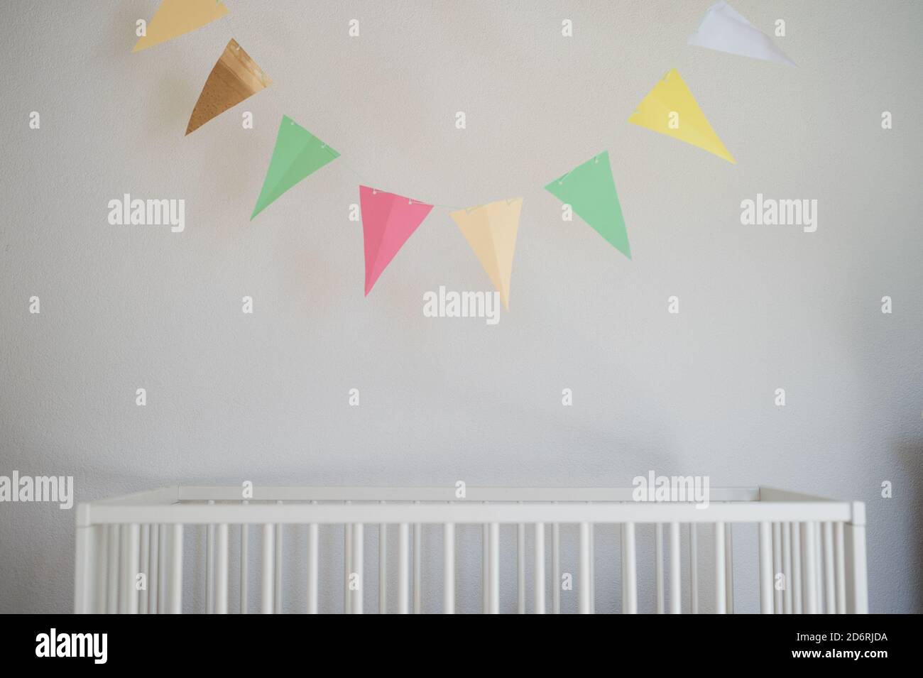 Cot in bedroom decorated for newborn baby Stock Photo Alamy