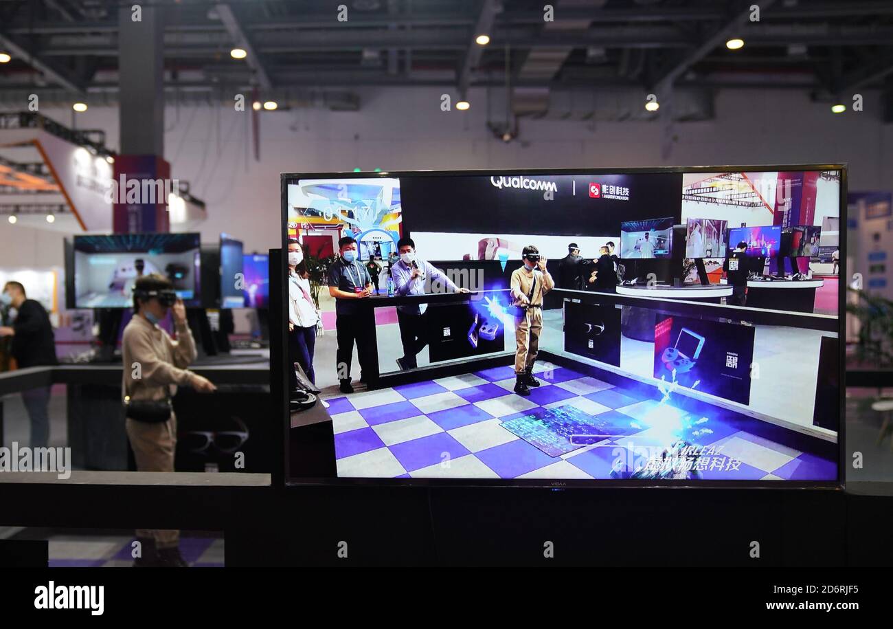Nanchang, China's Jiangxi Province. 19th Oct, 2020. A visitor plays games  based on AR (Augmented Reality) technology during the 2020 World Conference  on VR Industry in Nanchang City, east China's Jiangxi Province,