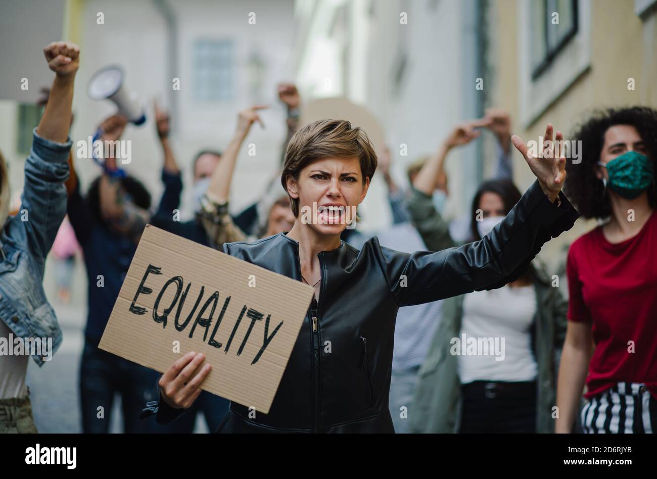 Activist Protesting Group of people activists protesting on streets, women march and ...