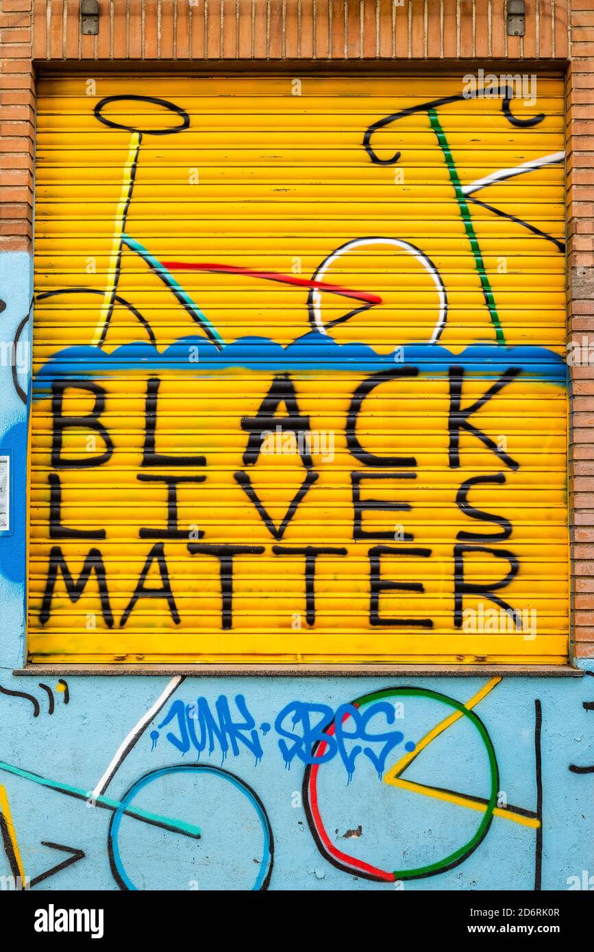 Madrid, Spain - October 20, 2020: Black Lives Matter sign painted in the shutter of a store in Lavapies quarter in Madrid Stock Photo