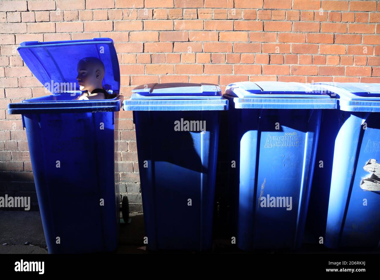 A female manikin sometimes called a mannequin head pops out from inside