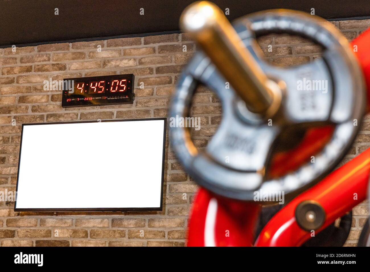 Barbell at workout gym, wall clock Stock Photo Alamy