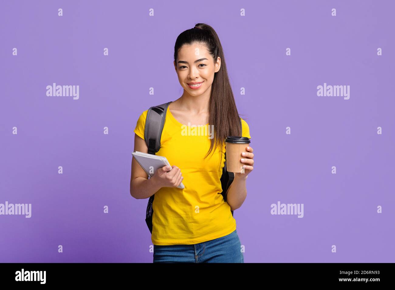 Happy Young Asian Female Student With Backpack And Coffee Over Purple ...
